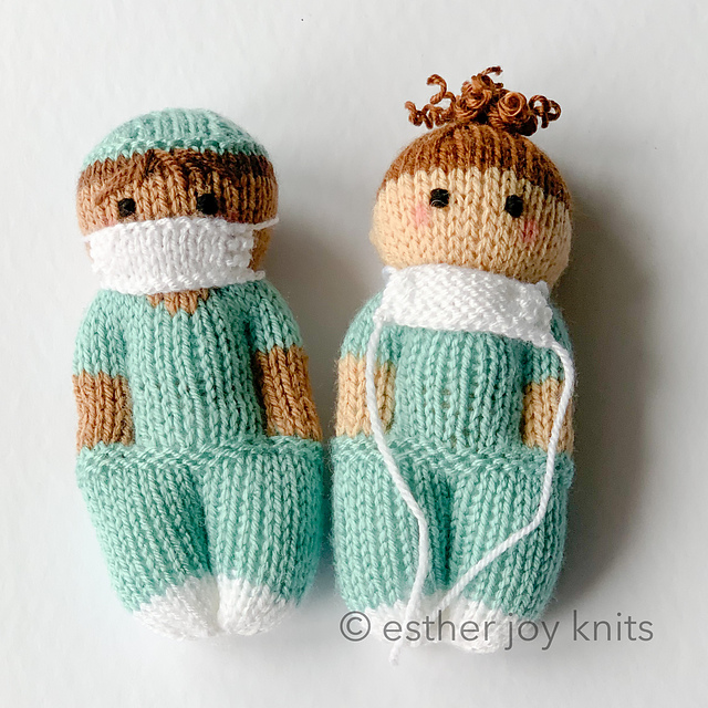 knitted nurse dolls on white background