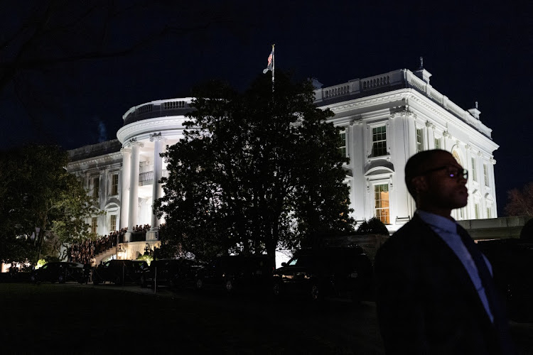 A Secret Service agent stands by as US President Joe Biden greets supporters following the State of the Union address at the White House in Washington, US, March 7, 2024.