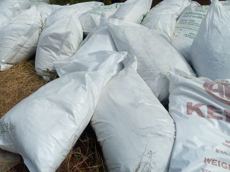 Organic fertiliser bags shared among the farmers present at Kanja on Monday.