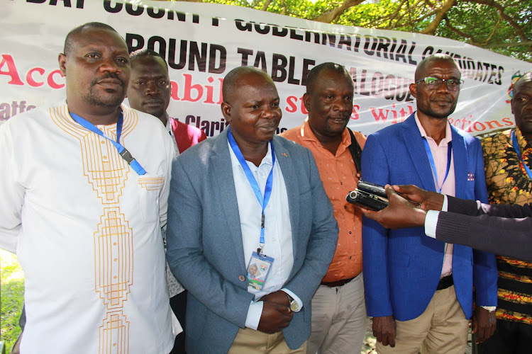 Civil society officials speak to the media in Homa Bay town on June 10