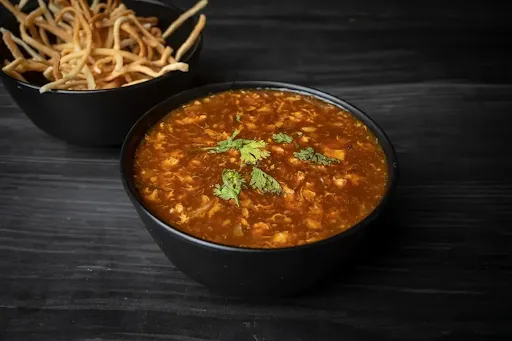 Chicken Manchow Soup With Fried Noodles