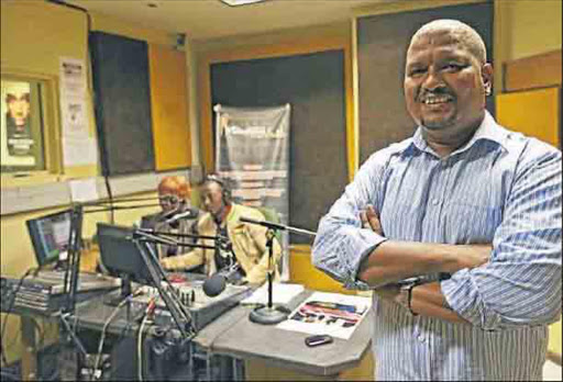 File picture of Mdantsane FM station manager, Xabiso Gqirana, seen here with news reader Sindy Mbusi and presenter Luvuyo 'Lava' Sobekwa working in the studio behind him.