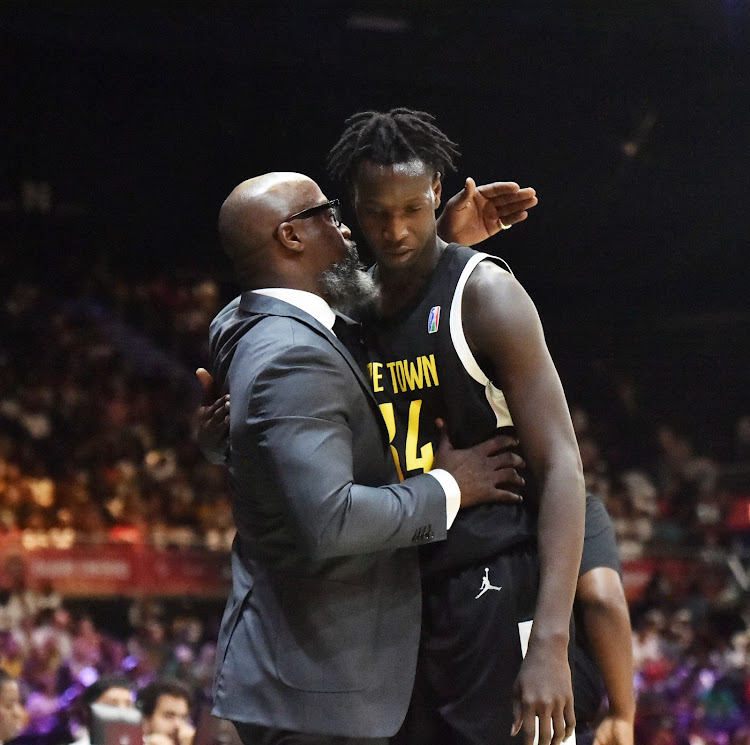 Cape Town Tigers CEO and co-founder Raphael Edwards comforts the youngest player in his team, Yakhya Diop, during their 2024 BAL match against FUS Rabat at the SunBet Arena in Pretoria on Sunday.