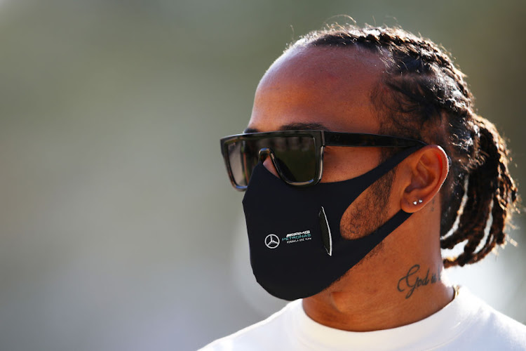 Lewis Hamilton of Great Britain and Mercedes GP walks in the paddock before the F1 Grand Prix of Bahrain at Bahrain International Circuit on November 26, 2020.