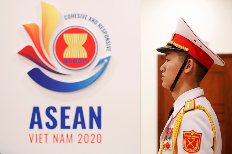 A military soldier stands guard at the ASEAN summit in Hanoi, Vietnam November 12, 2020.