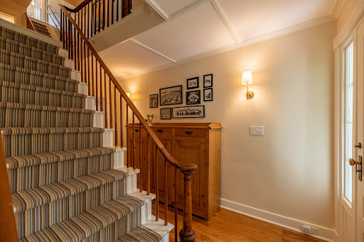 Staircase with striped carpet, wooden furniture - Buy this luxury house in Manchester, 5 bedrooms
