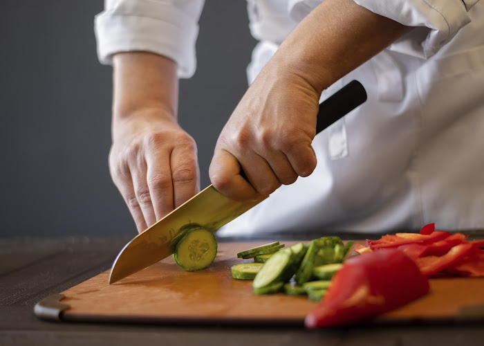 close-up-hands-cutting-cucumber.jpg