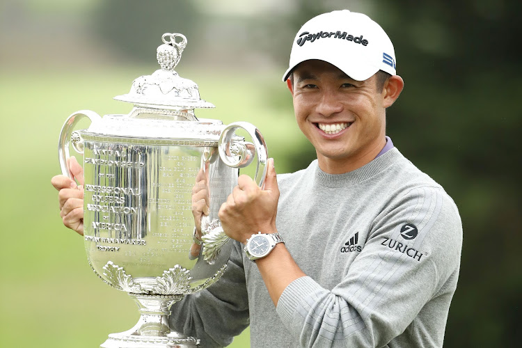 Collin Morikawa of the United States celebrates with the Wanamaker Trophy after winning the 2020 PGA Championship at TPC Harding Park on August 9, 2020 in San Francisco, California