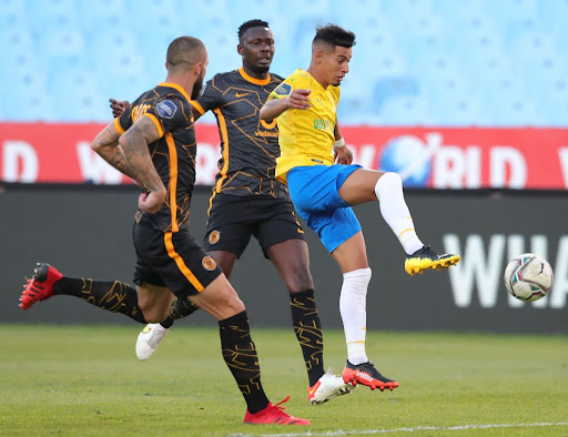 PRETORIA, SOUTH AFRICA - SEPTEMBER 12: Gaston Sirino of Mamelodi Sundowns challenged by Daniel Cardoso and Ricardo Nascimento of Mamelodi Sundowns during his side's DStv Premiership match against Kaizer Chiefs at Loftus Versfeld Stadium on September 12, 2021 in Pretoria, South Africa.