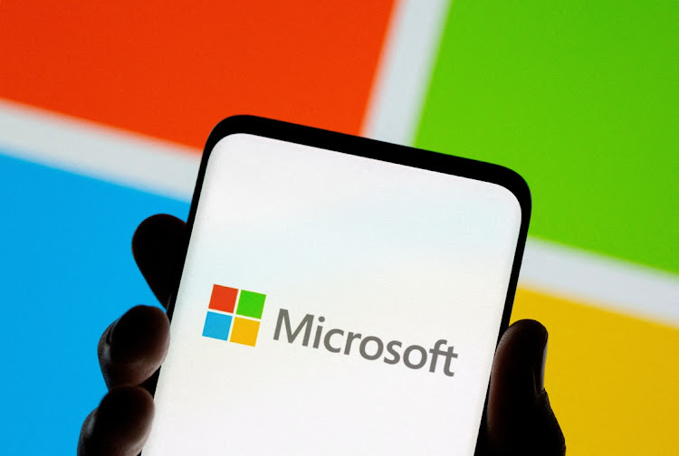 FILE PHOTO: Smartphone is seen in front of Microsoft logo displayed in this illustration taken, July 26, 2021.