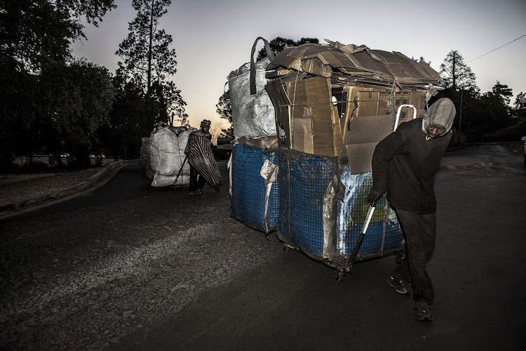 Lucas Ngwenya recycles cardboard.