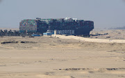 A view shows the stranded container ship Ever Given, one of the world's largest container ships, after it ran aground, in the Suez Canal, Egypt. 