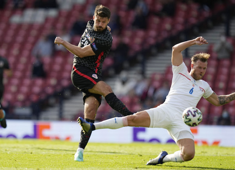 Croatia's Bruno Petkovic shoots under the attention of Czech Republic's Tomas Kalas in the Euro 2020 Group D at Hampden Park, Glasgow on June 18, 2021