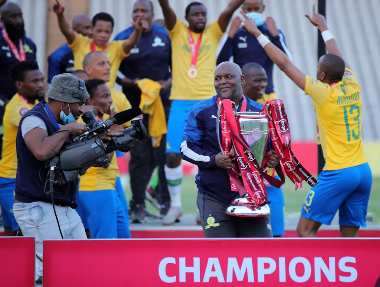 Pitso Mosimane and his Mamelodi Sundowns players celebrate after winning Premiership title.