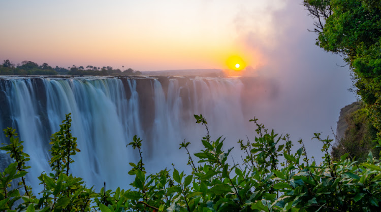 Victoria Falls at sunset.