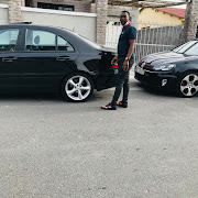 Lwazi Landzela with his father's Mercedes Benz and VW Polo which were allegedly used by the kidnapping syndicate he is allegedly a member of. Both cars have been seized by the police.