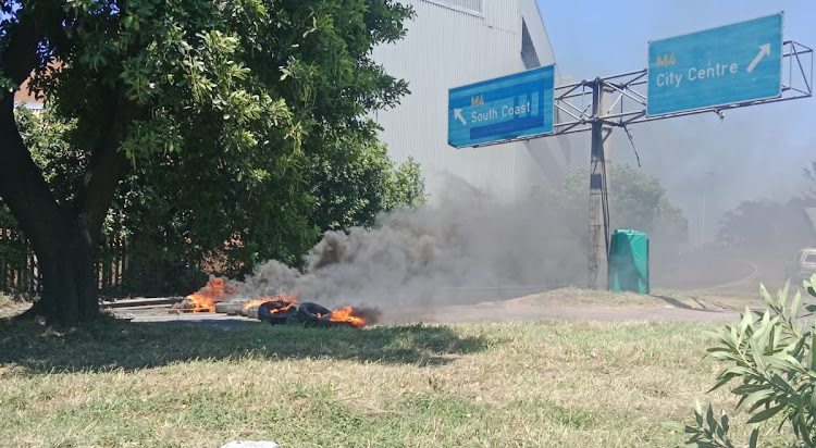 The M4 freeway to Durban was blocked by burning tyres and branches as part of an ongoing wildcat strike by eThekwini municipality workers