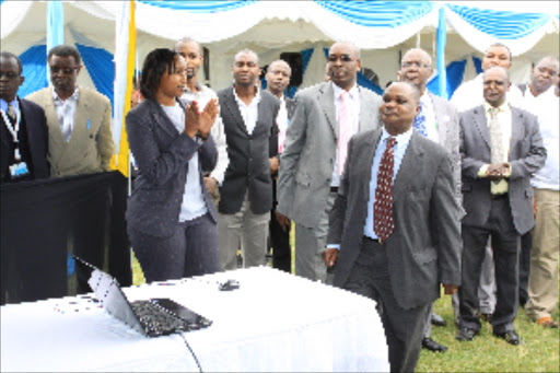 University of Nairobi acting vice chancellor Isaac Mbeche unveils the FASU Games logo in 2014.