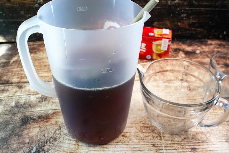 Pour Tea Into A Gallon Container And Add Remaining Water.