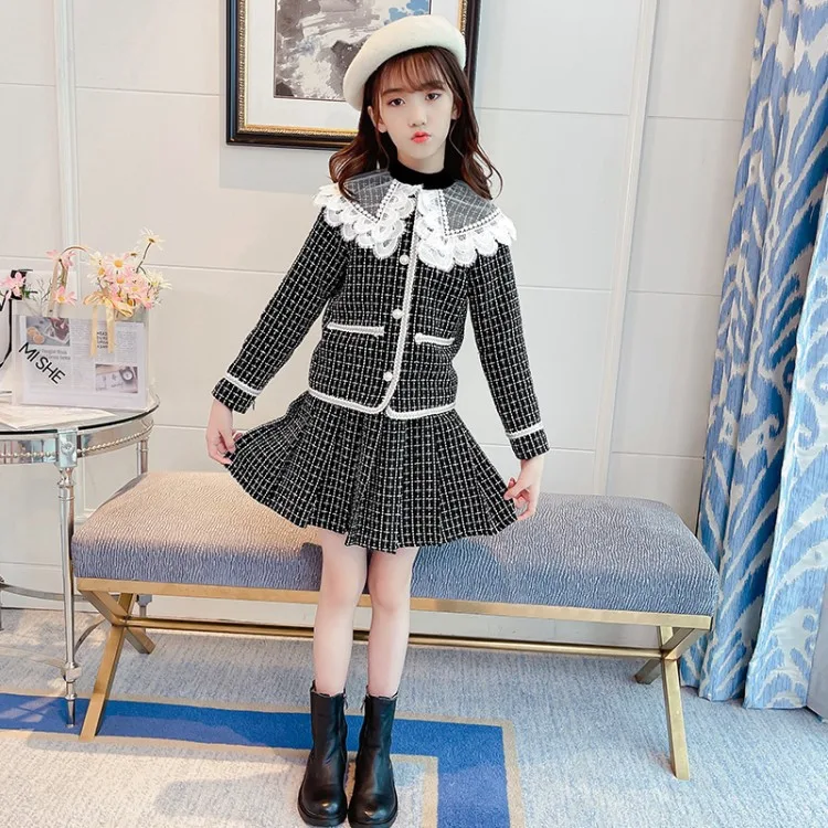 Houndstooth rok met revers in westerse stijl. Een stijlvolle en klassieke rok die perfect is voor een elegante look. Comfortabel en flatterend ontwerp.