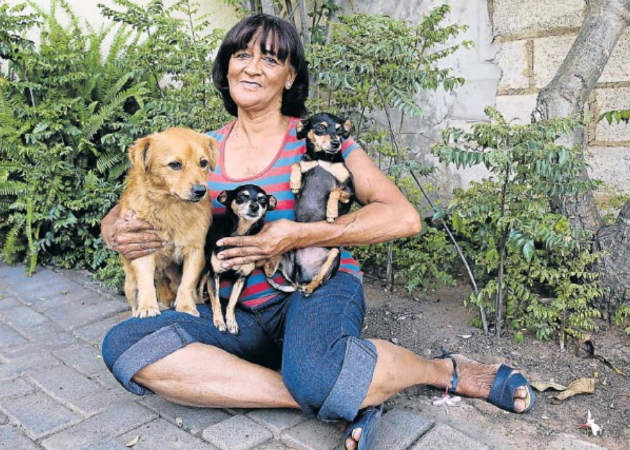 Patsy Wagner, 70, from Hillside retired from the Animal Anti-Cruelty League earlier this month. Here she is with her dogs, from left, Cody, Minkie and Georgie