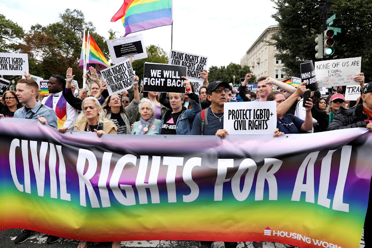 LGBT activists block a street outside the US Supreme Court in 2019 as it hears arguments in a major LGBT rights case on whether a federal anti-discrimination law that prohibits workplace discrimination on the basis of sex covers gay and transgender employees.