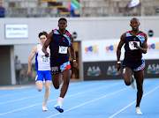 Sinesipho Dambile, right, on his way to winning the SA 200m crown at Green Point on Saturday. Benjamin Richardson finished third and Liam Buck, left, was seventh.