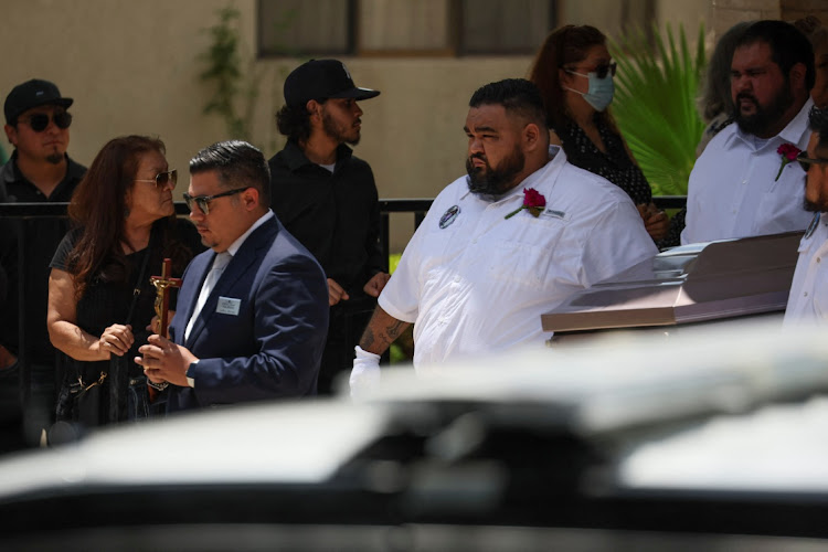 Pallbearers carry the coffin of Amerie Jo Garza out of the Sacred Heart Catholic Church after the funeral service for one of the victims of the Robb Elementary school mass shooting that resulted in the deaths of 19 children and two teachers, in Uvalde, Texas, U.S., May 31, 2022.