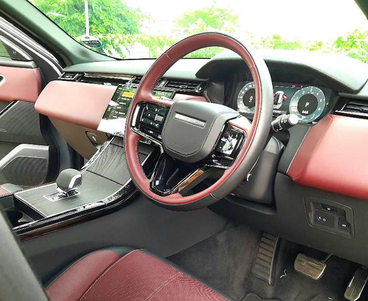 The interior has few buttons but it can be decorated in many ways, including this bright red and black theme.