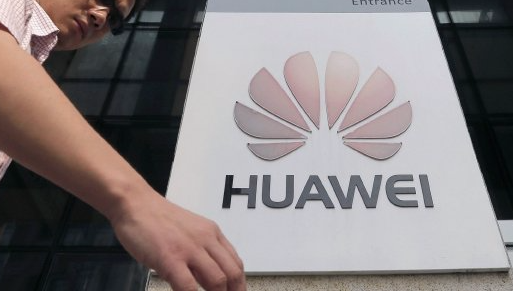 A man walks past a Huawei company logo outside the entrance of a Huawei office in Wuhan, Hubei province, China. Picture: REUTERS