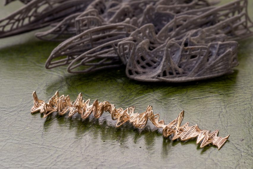 Close-up photo of two intricate abstract objects with interwoven patterning