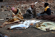 The mothers of the children sat on the tar road amid the stench of sewage‚ with heaps of rubbish and piles of bricks near them‚ waiting for the bodies to be collected. 