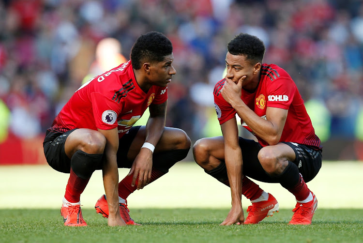 Manchester United's Marcus Rashford speaks with Jesse Lingard