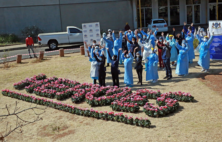 Ubuntu Beds and Together We Bloom surprised health-care workers at Charlotte Maxeke hospital with bouquets of flowers spelling out the word "heroes".