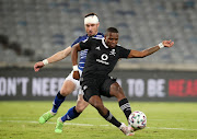 Tshegofatso Mabasa of Orlando Pirates challenged by Ryan Rae of Maritzburg United during the Nedbank Cup semi final match between Mamelodi Sundowns and Tshakhuma FC at Loftus Versfeld Stadium on April 18, 2021 in Pretoria.