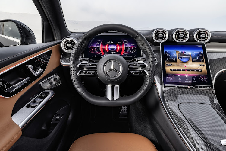 The latest dual-screen Mbux infotainment system is standard.