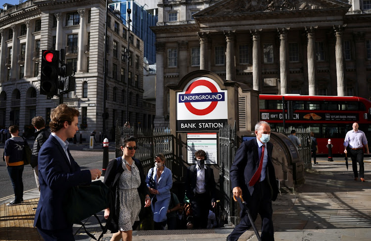 People exit Bank underground station during morning rush hour in London, Britain, July 29 2021. Picture: REUTERS/HENRY NICHOLLS