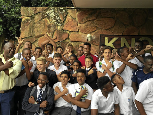 Orlando Pirates captain Happy Jele with St Alban's College pupils.