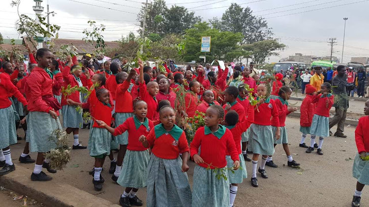 Pupils of St Teresa Primary School protest along Juja Road on May 13