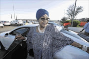 DEFIANT:
      
      
      
      Winnie  Madikizela-Mandela   at Mthatha  Airport  on Sunday, 
      
       after attending a  cleansing ritual in Qunu to mark a year since Nelson Mandela's death
      
      
      
      photo: LULAMILE FENI