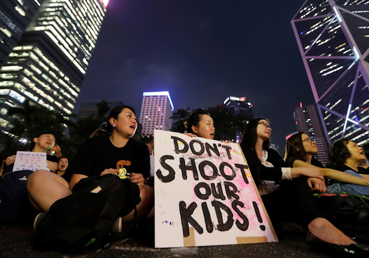 People attend a rally in support of demonstrators protesting against proposed extradition bill with China, in Hong Kong, China, on June 14 2019.