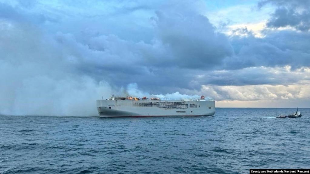 Smoke rises as a fire broke out on the cargo ship Fremantle Highway, at sea, July 26, 2023. 