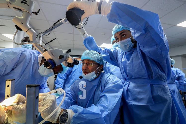 Neurosurgeons Ramesh Nair and Dr Aamir Qureshi guide medics during a training programme on brain surgery at the University of Nairobi Surgical Skills centre during the sidelines of the 4th Annual continental association of African Neurological Societies Congress in Nairobi on November 8, 2022..
