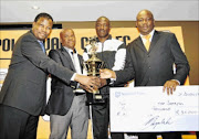 ON TARGET: Polokwane City marksman Essau Kanyenda, second from right, receives the leading goalscorer and player of the season awards at a ceremony  in Polokwane. With him are PSL COO Cambridge Mokonyane, Polokwane City chairman Johnny Mogaladi and club  COO Tincy Tema
      Photo: Mpho Hlapisi/Bochabela Photography