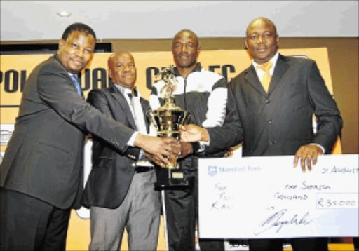 ON TARGET: Polokwane City marksman Essau Kanyenda, second from right, receives the leading goalscorer and player of the season awards at a ceremony in Polokwane. With him are PSL COO Cambridge Mokonyane, Polokwane City chairman Johnny Mogaladi and club COO Tincy Tema Photo: Mpho Hlapisi/Bochabela Photography