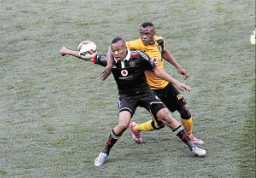 DEJA VU?: Lehlohonolo Majoro of Orlando Pirates fights for the ball with Kaizer Chiefs' Tsepo Masilela in a previous match between the teams Photo: Veli Nhlapo