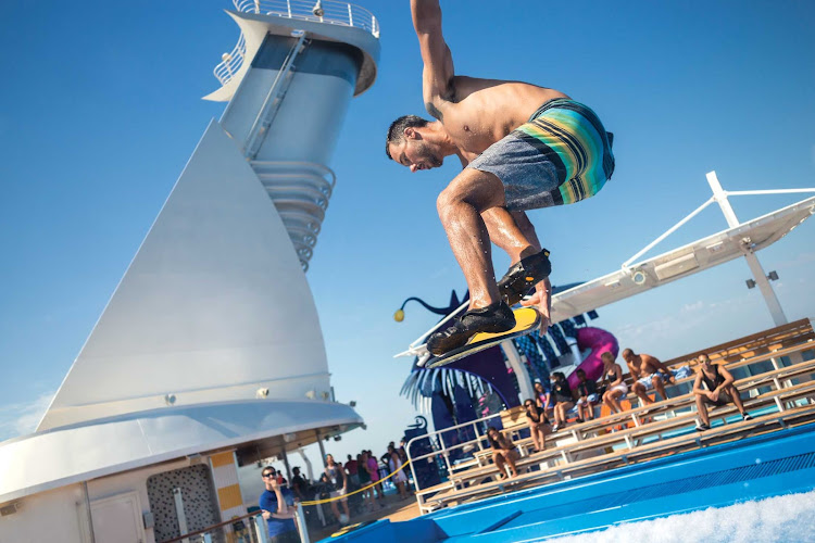 An instructor shows off an advanced move on FlowRider aboard Harmony of the Seas. 