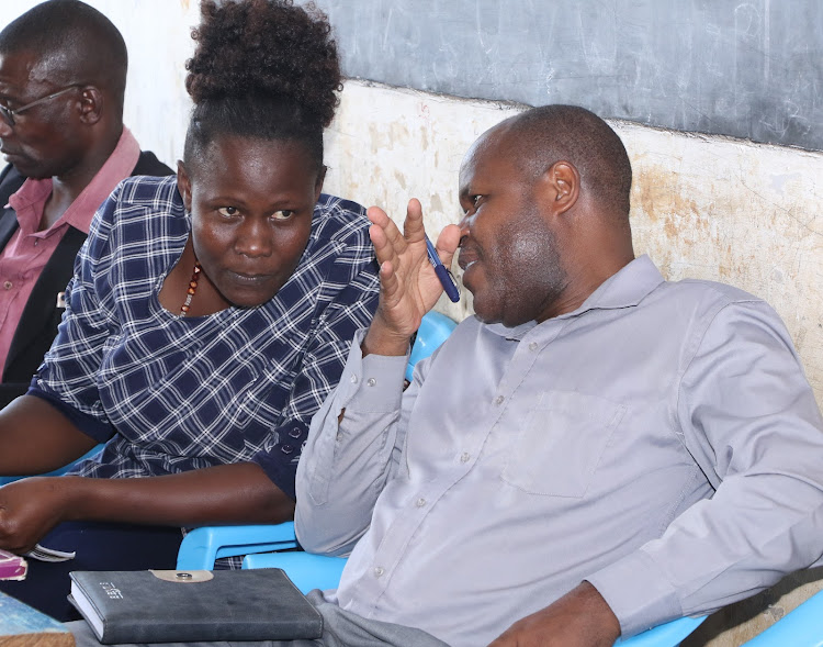 Butula subcounty administrator Caroline Oduor and Water chief officer during site hand-over for Elugulu Bwaliro water project to a contractor