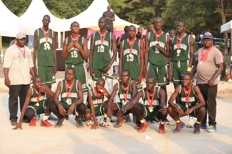 Agoro Sare basketball team poses for a group photo after clinching Biro Lich tournament in Kisumu