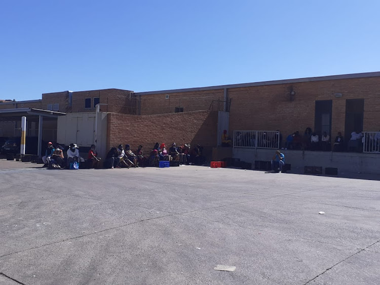 At Shoprite Supermarket, in Atteridgville, social grant beneficiaries were provided with chairs and crates to sit on.